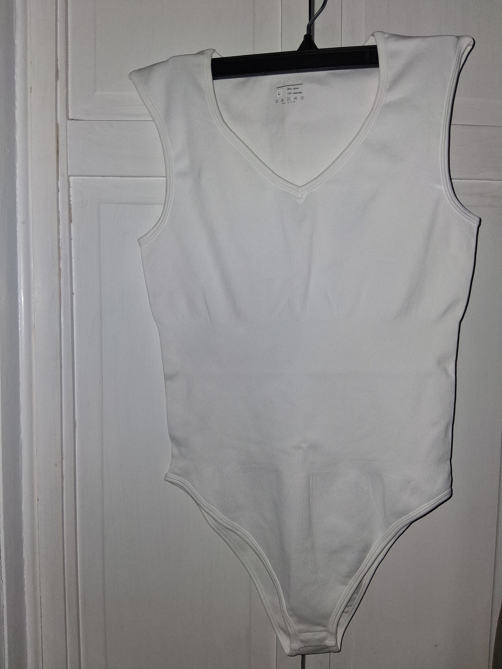 OQQ Women's White Sleeveless V-Neck Bodysuit